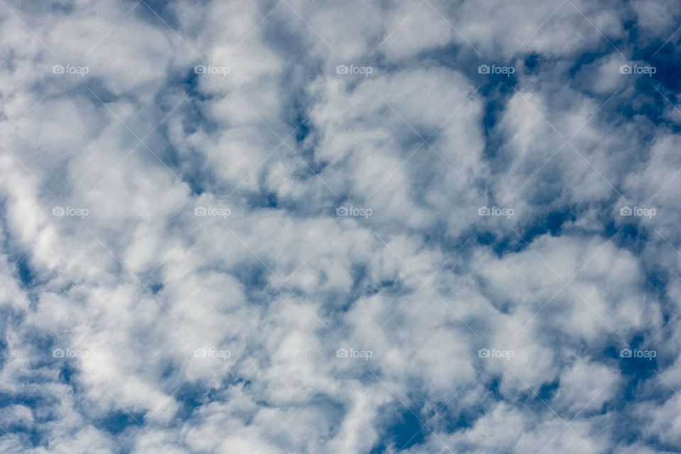 The beauty of the sky with clouds and the sun.