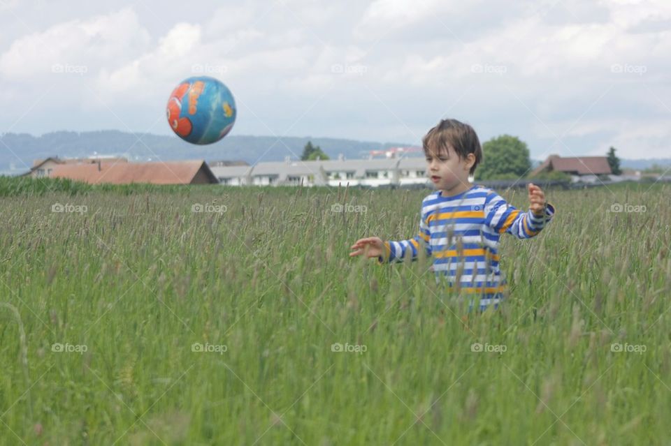 Kid Playing With Ball