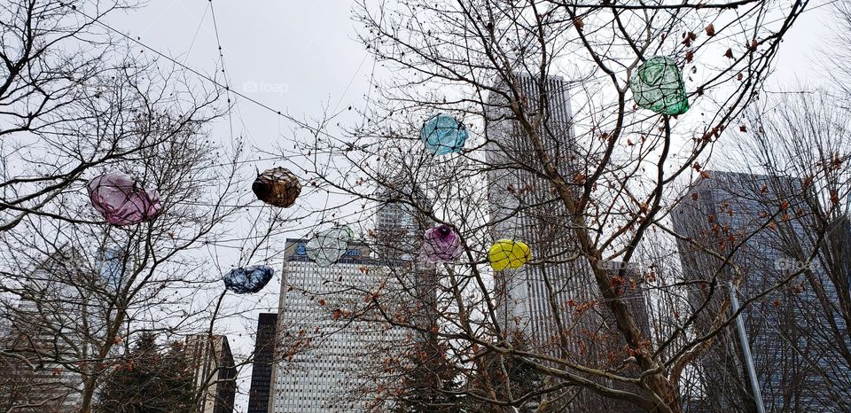 Colored paper Balloons hanging on tree Branches