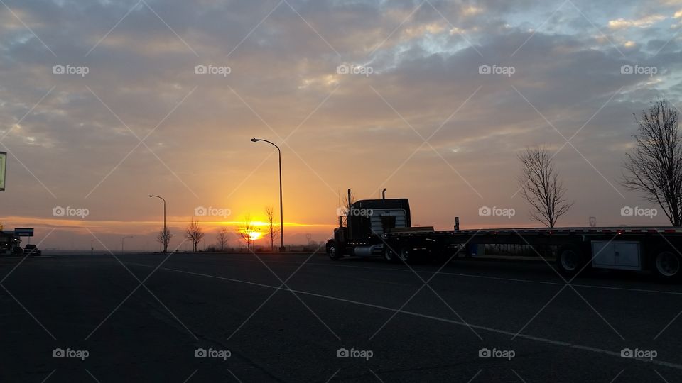 sun rising on freeway