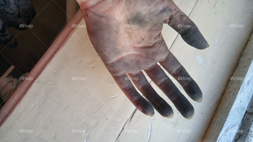 Dirty hand after fixing bicycle.