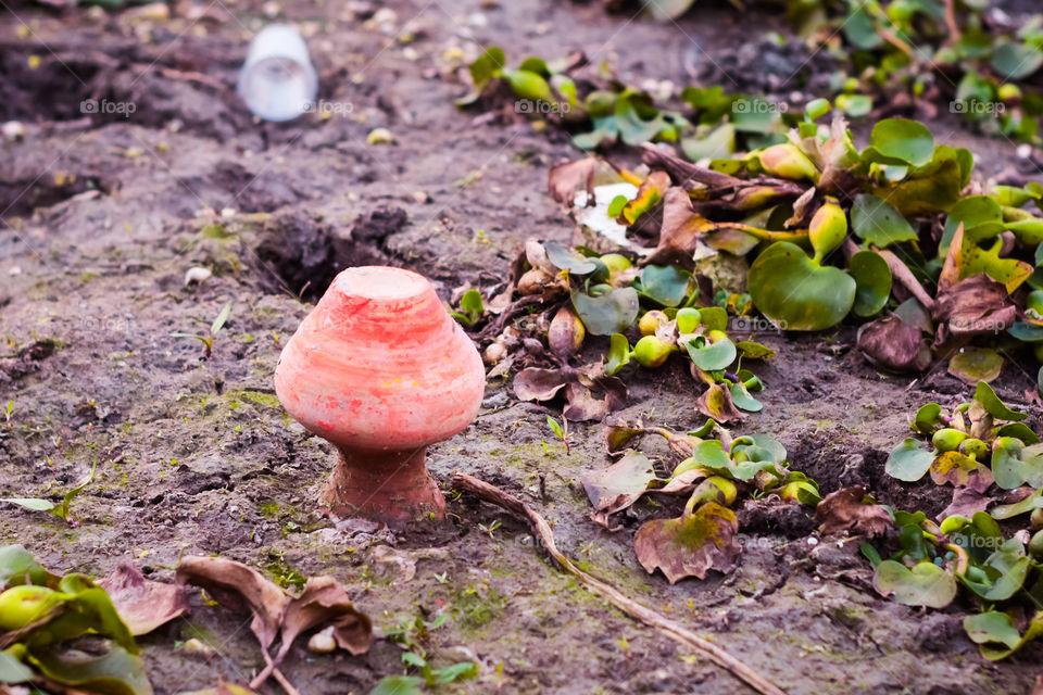 A Golden Mangal Kalash at riverbank after immersion of Maa Durga Idol in Ganges river in Durga visarjan celebration, Last day of Durga Puja. Photo depicts the emotions of devotees farewell to deity.