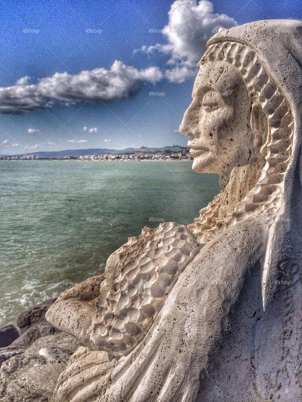 Statue of Madonna with baby on the sea