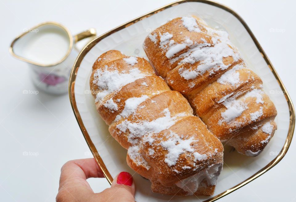 cake on a plate in hand