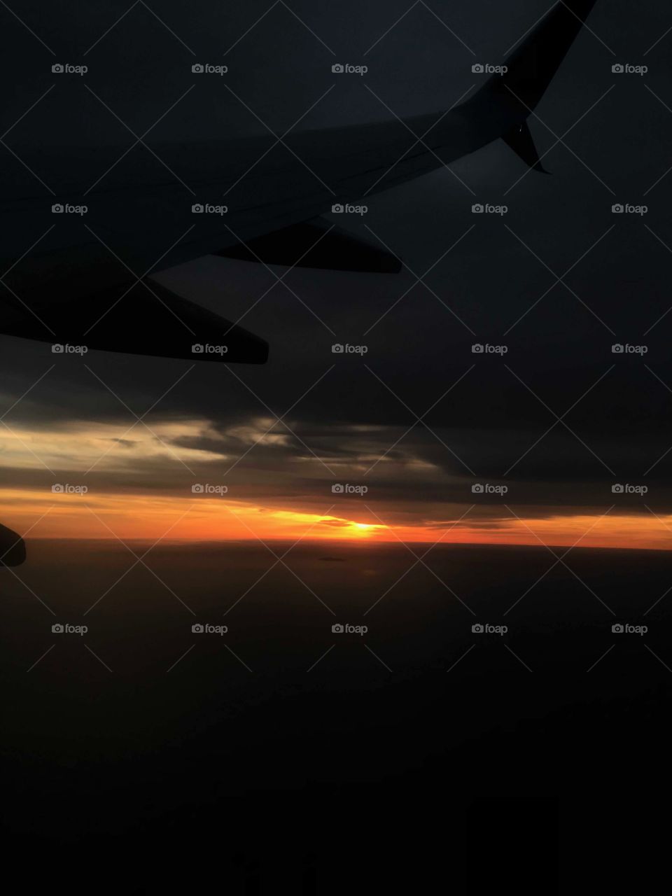 View taken from airplane of sunset 