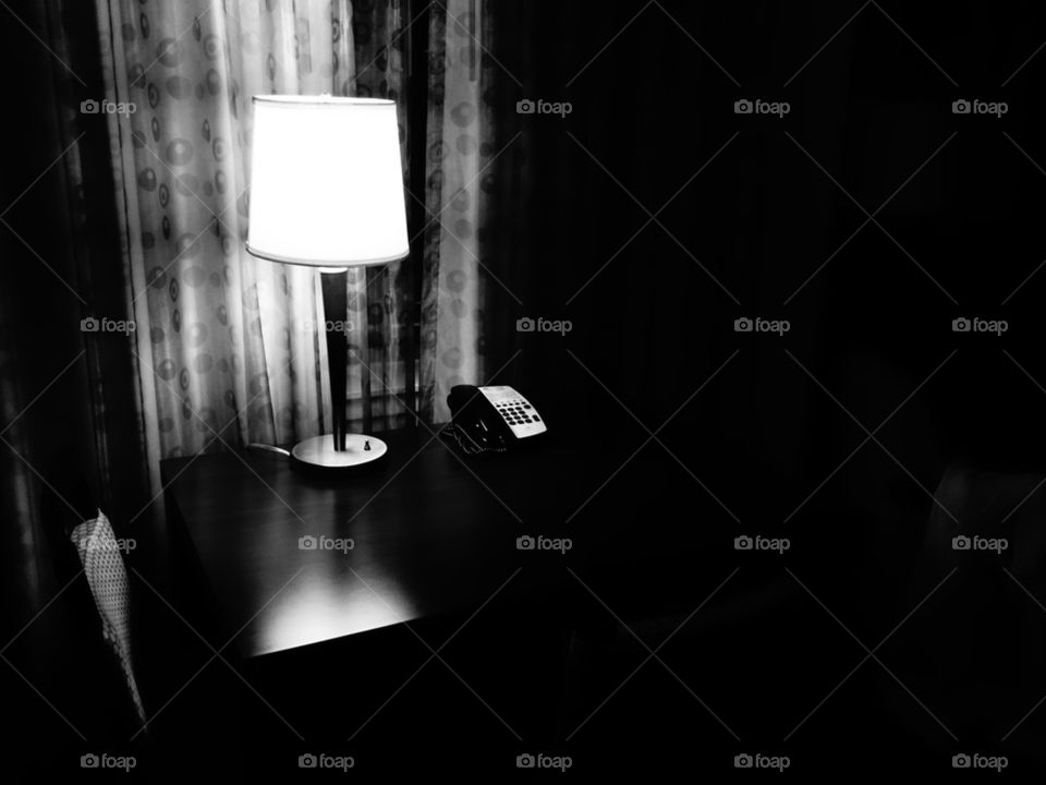 desk and lamp in black and white