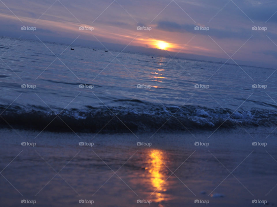 Surf at Baltic sea during sunrise