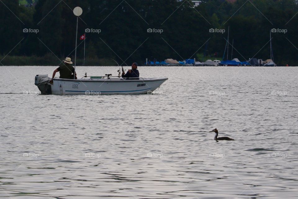 Men Fishing On  Misty Lake