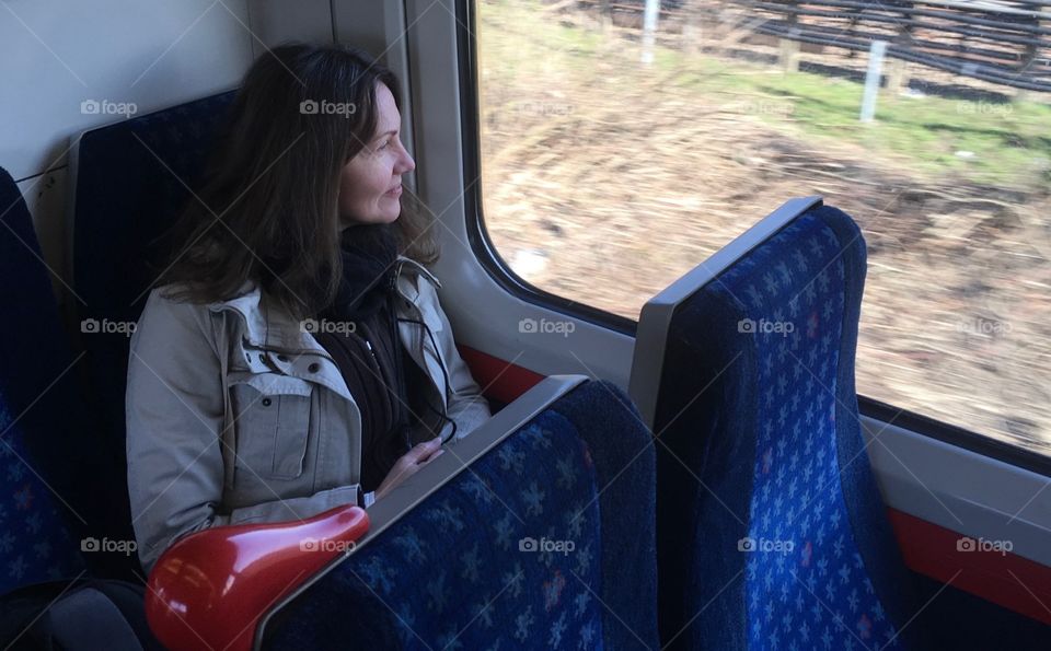 Woman is in a train