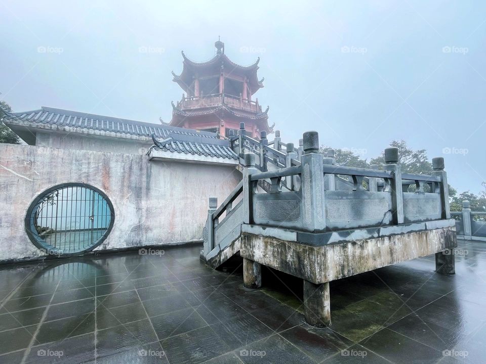 Surrounded by clouds and fog