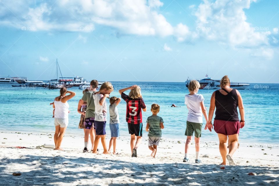 Family's hour on the beautiful beach