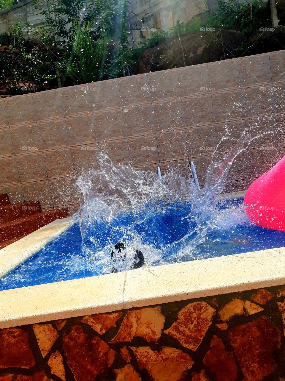 splashing in a summer pool