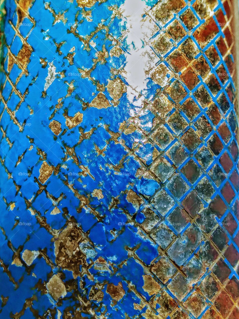 textured metal pole blue paint chipping and metal rusting
