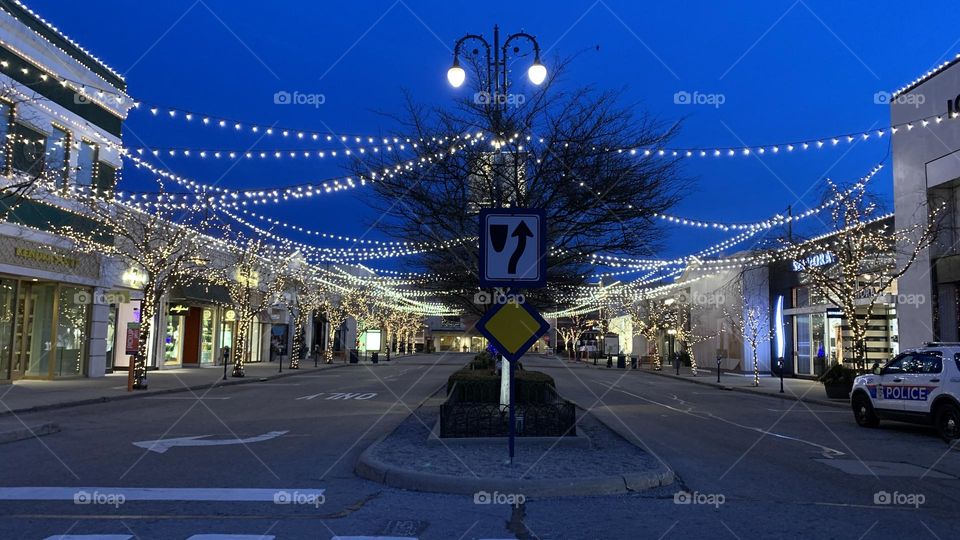 An early morning commute to the local Coffee bar. Few are out on this cold morning, but no doubt they have the same goal in mind. They’re greeted by holiday lights not yet taken down. Beautiful accents to the buildings and trees.