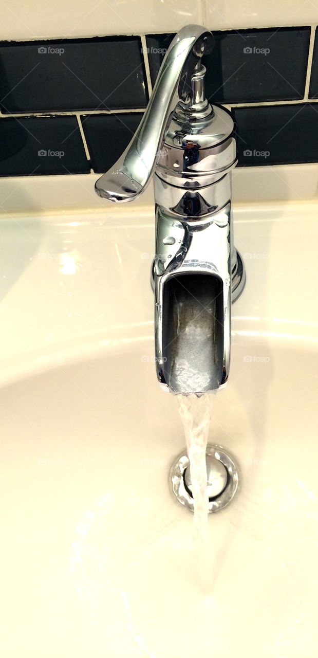 The Faucet. Elegant faucet at a wash basin