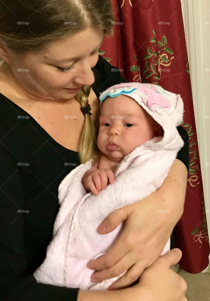 Baby wrapped in towel after her bath 