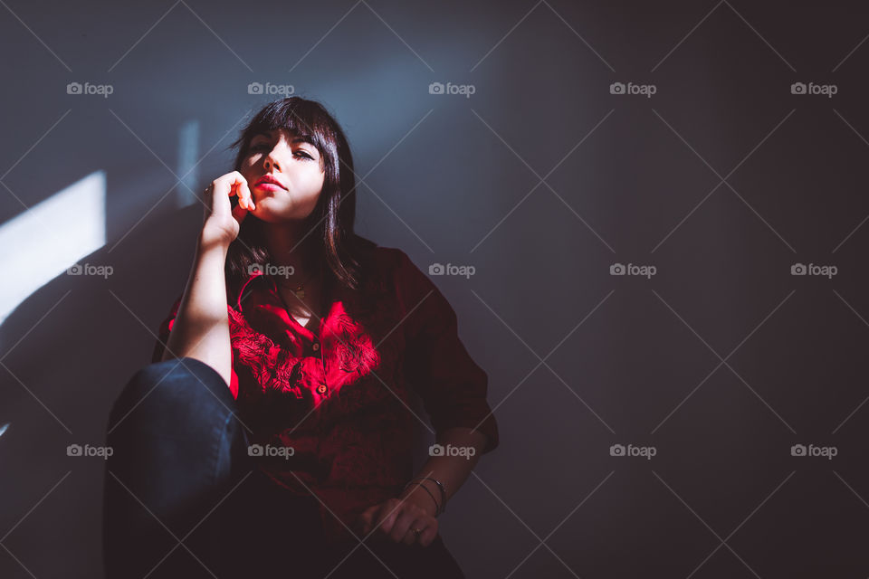 Portrait of young woman with red shirt. Lights and Shadow