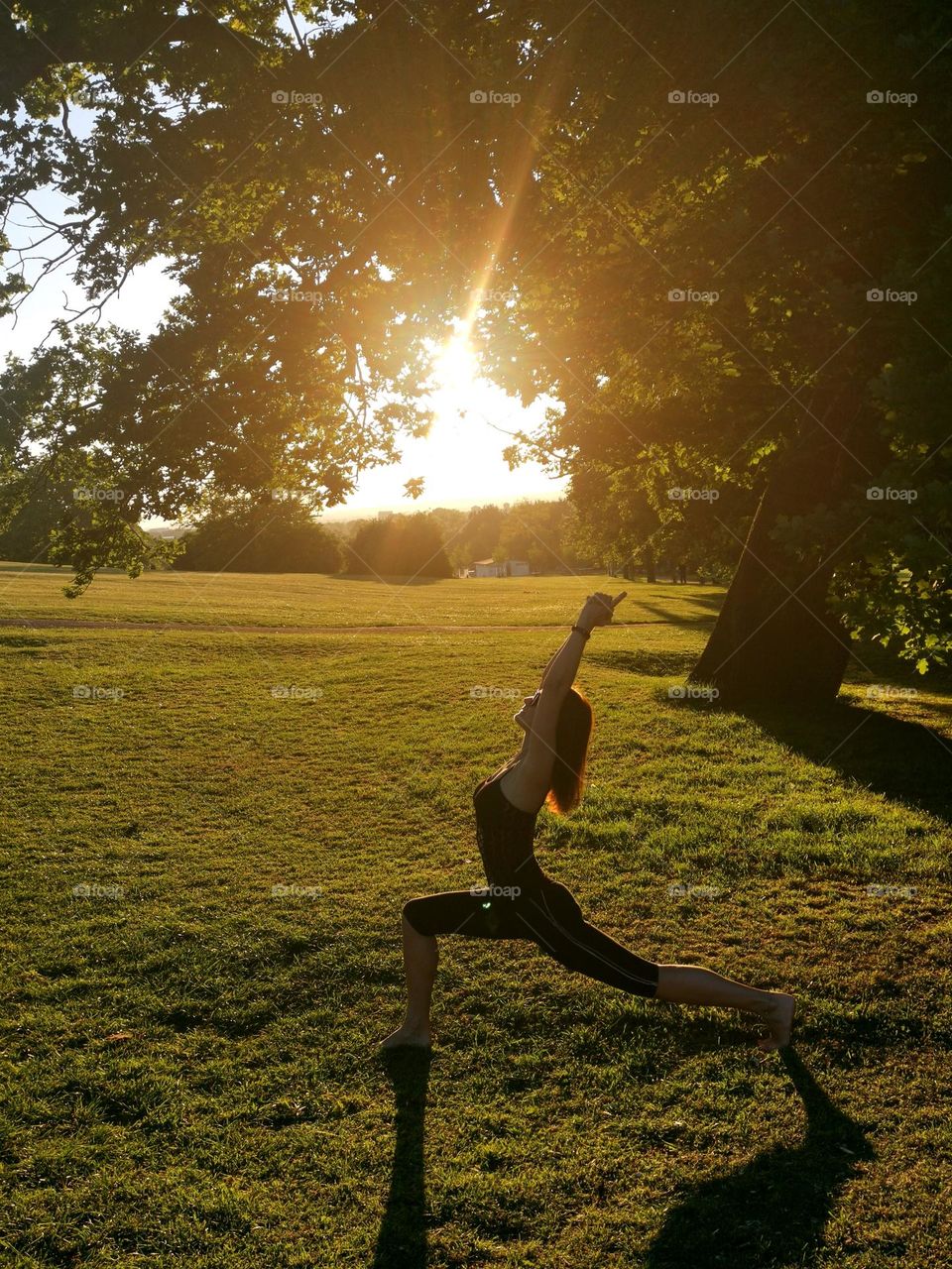 Yoga in the park. Outside yoga. Sunset and yoga.