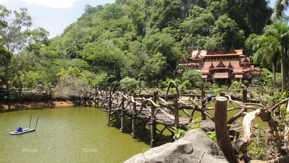 Beautiful wood carving monk garden in Thailand, the bridge