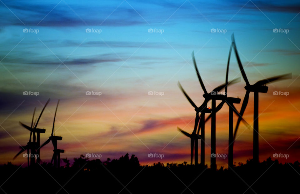 Silhouette of a windmill during sunset