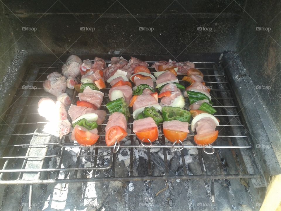 Skewers of pork and vegetables on the barbecue