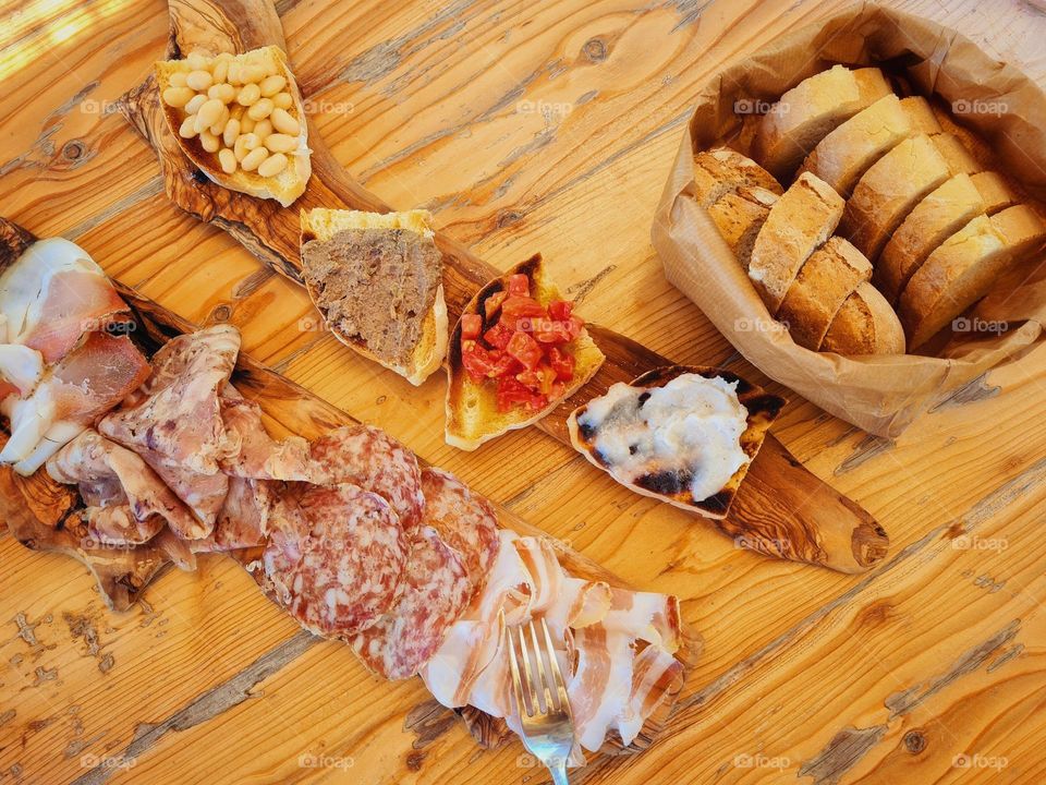 Italian cold cuts and cheeses platter photographed from above