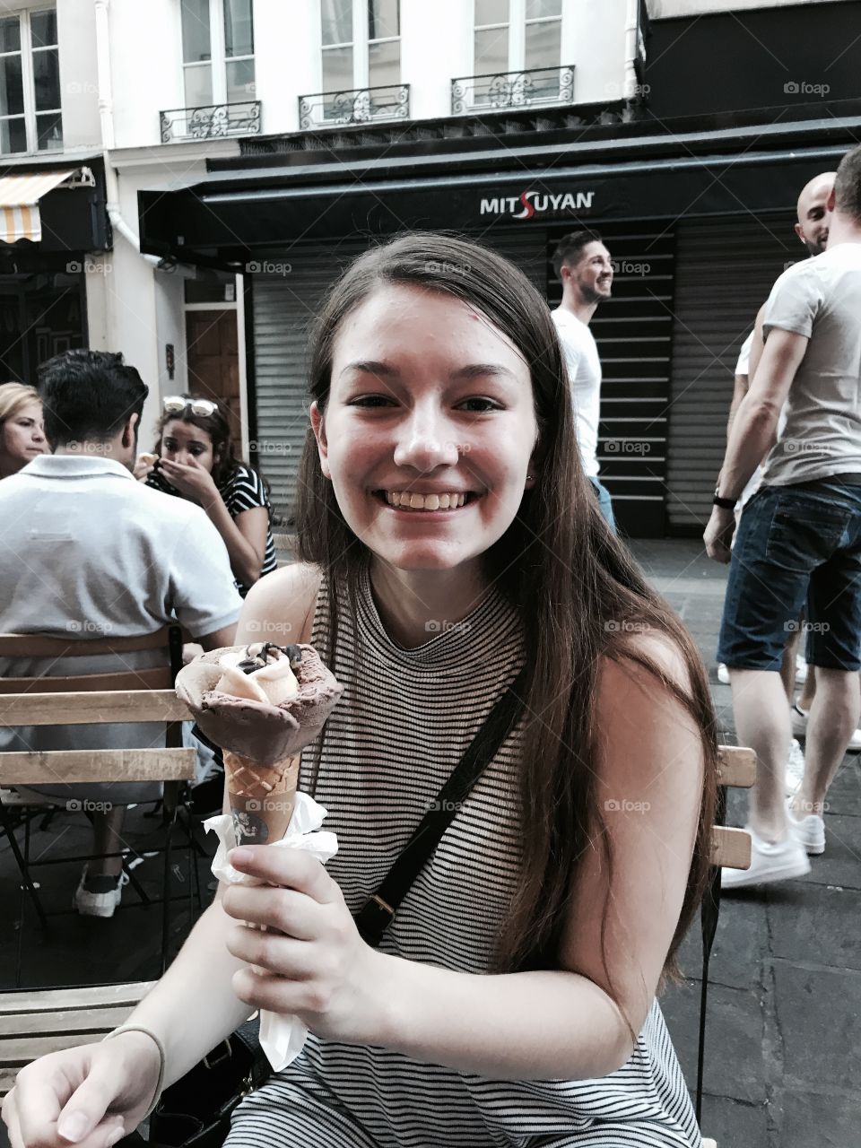 Happy woman holding ice cream