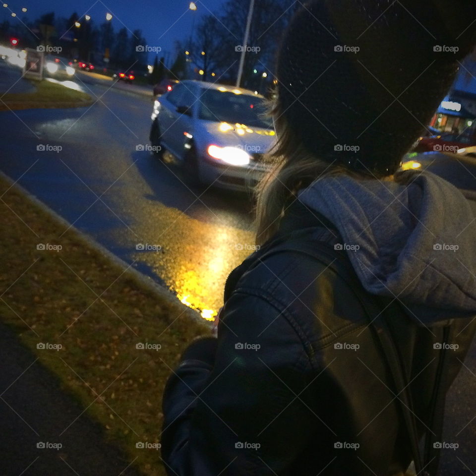 Girl walking in the city at the evening