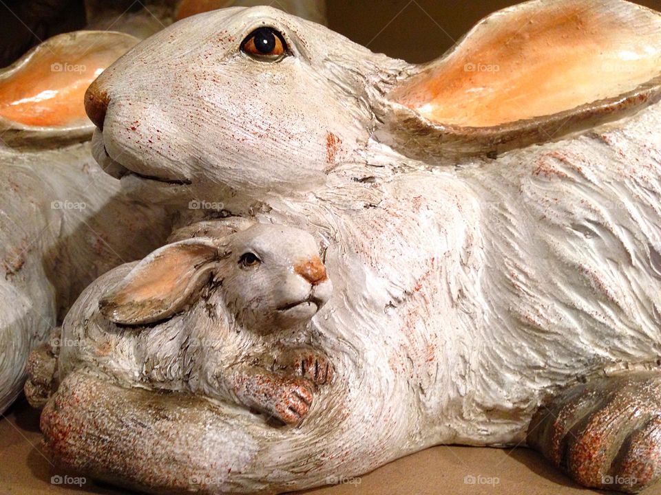 Mother and baby bunny statue.