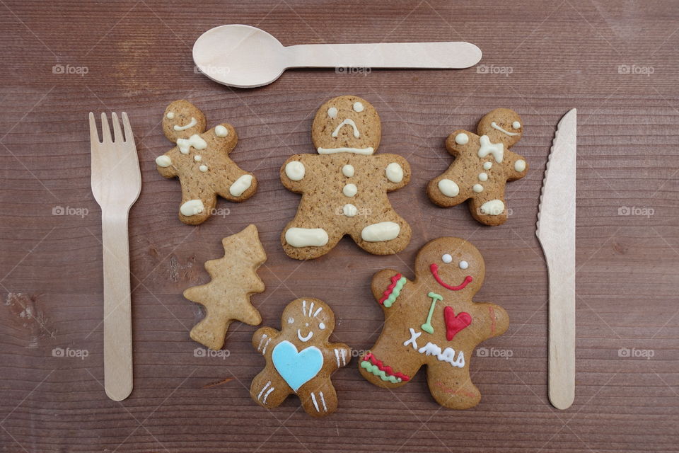 Christmas homemade gingerbread cookies on wooden table, time to eat them