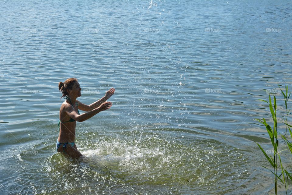 smiling woman in water 💦 lake summer time