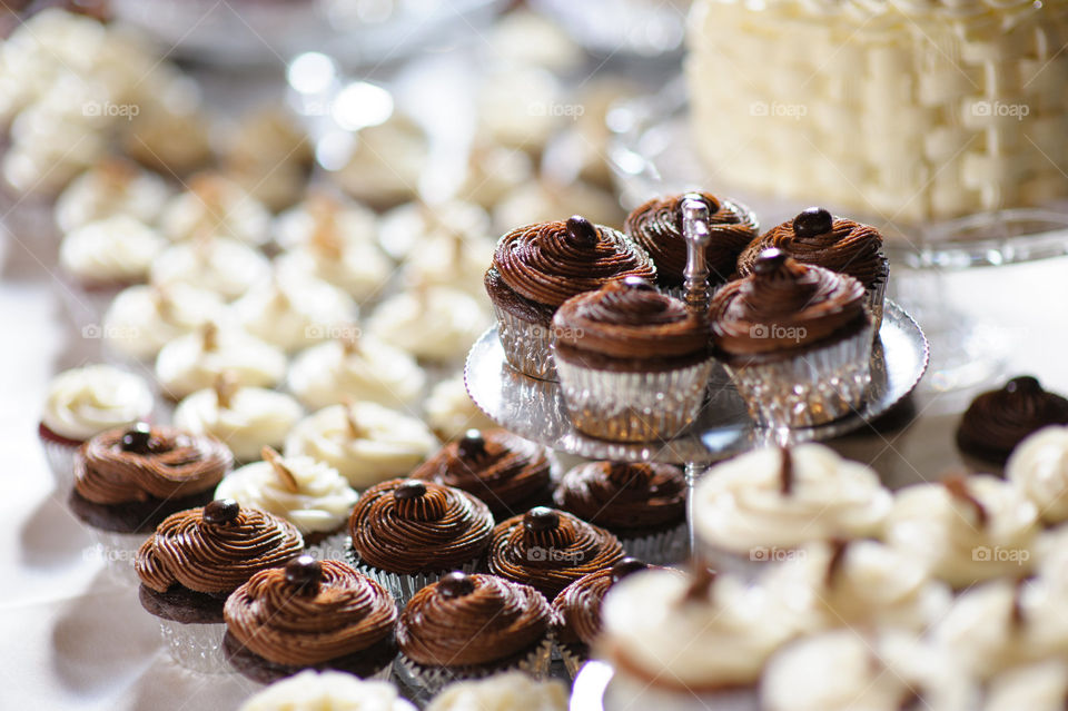 Delicious Looking Vanilla and Chocolate Flavor Cupcake Table - Festive Wedding Cake Dessert Confection Spread 