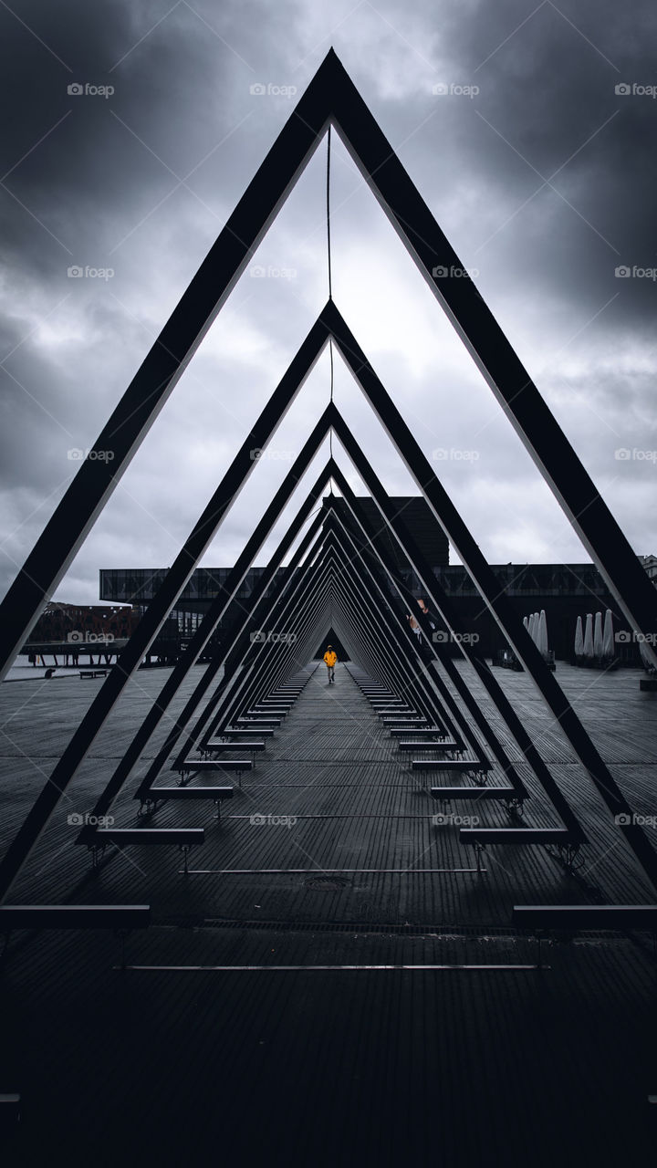 Man between triangle