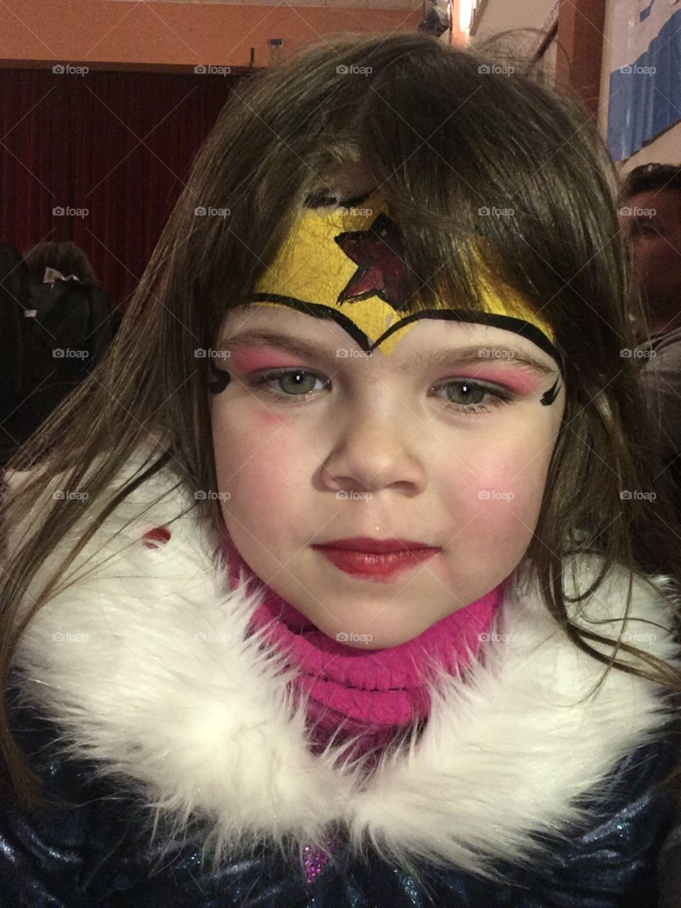 Girl costume carnival party Wonder Woman fur make up paint face sleep star child expression long hair model 