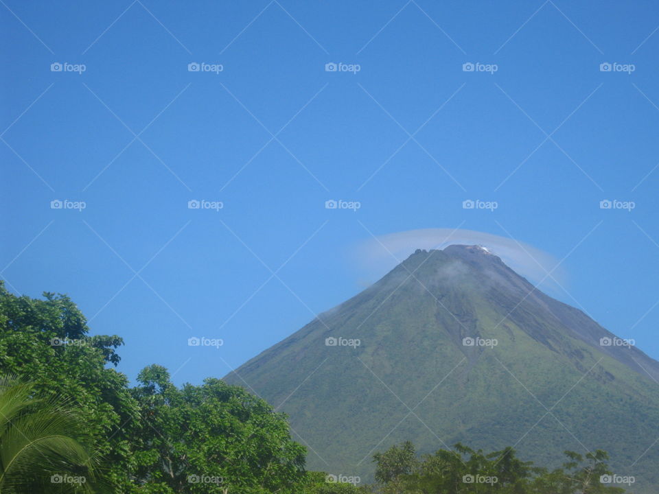 The Arenal volcano in Costa Rica with a cloud helo on the top.