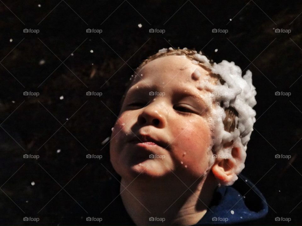 Young boy in snow storm