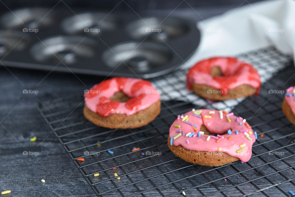 Close-up of freshly baked homemade donuts with sprinkles