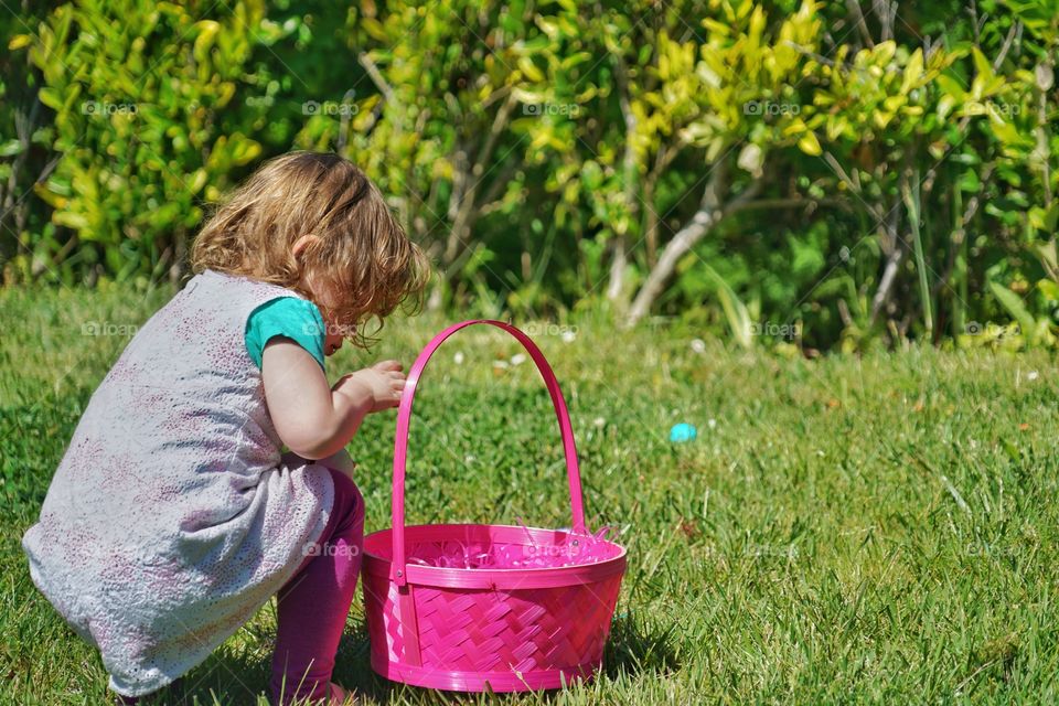Toddler Girl With Pink Easter Basket