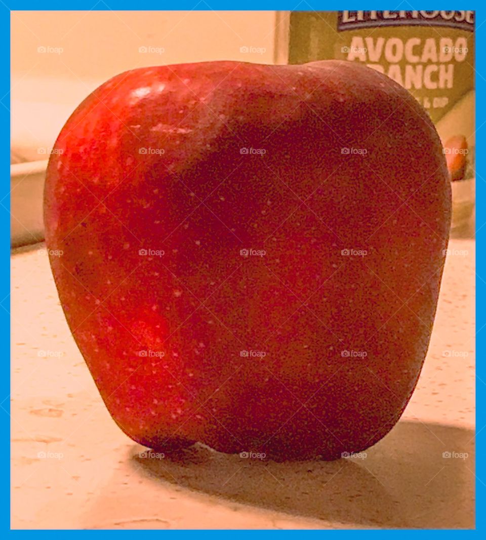 A delicious red apple as a late night dessert.