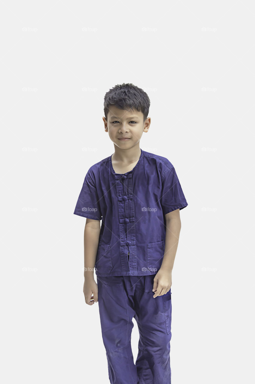 Asian boy wearing native Thailand and smile happily on a white background with clipping path.