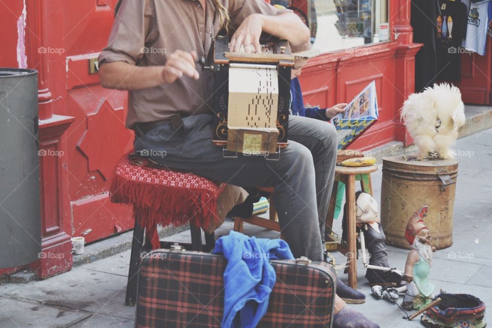 Musician playing music in the streets of porto 