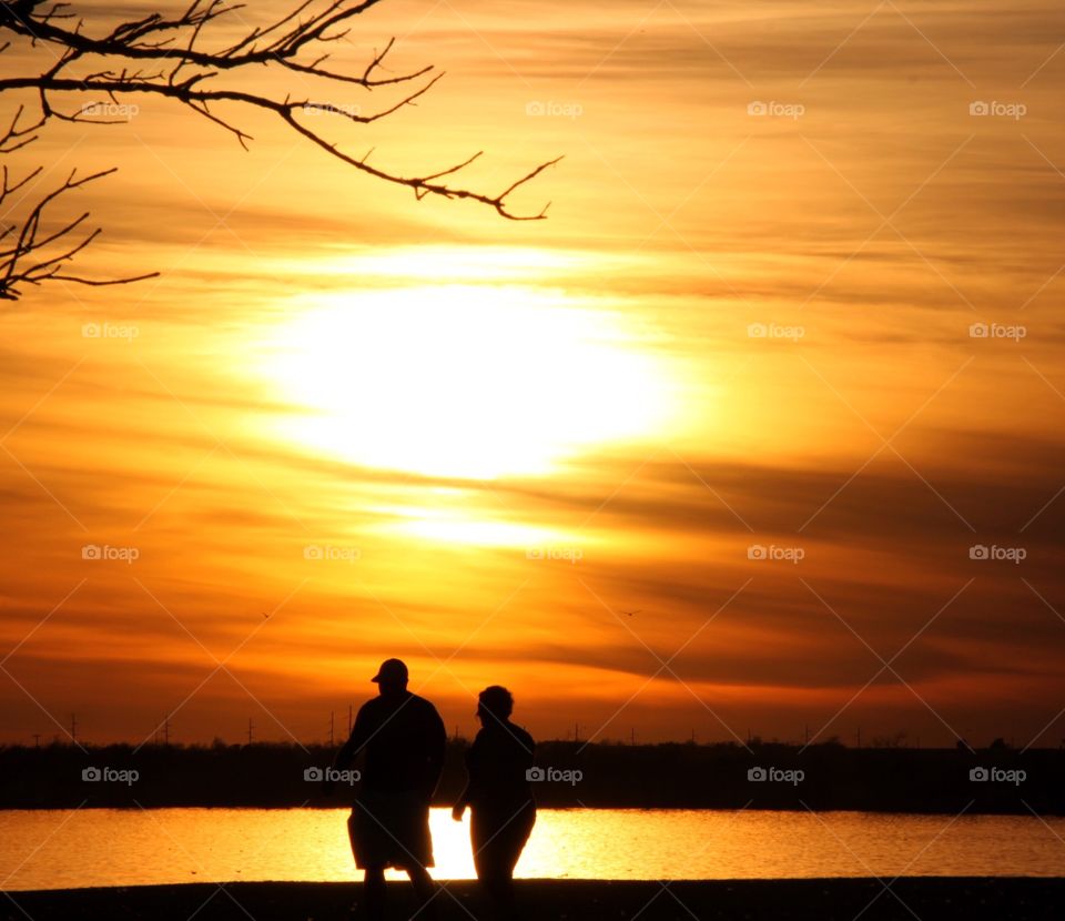 Couple Taking A Sunset Stroll