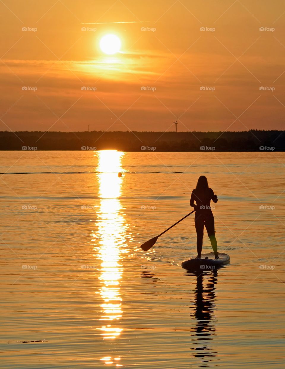 Paddler in sunset