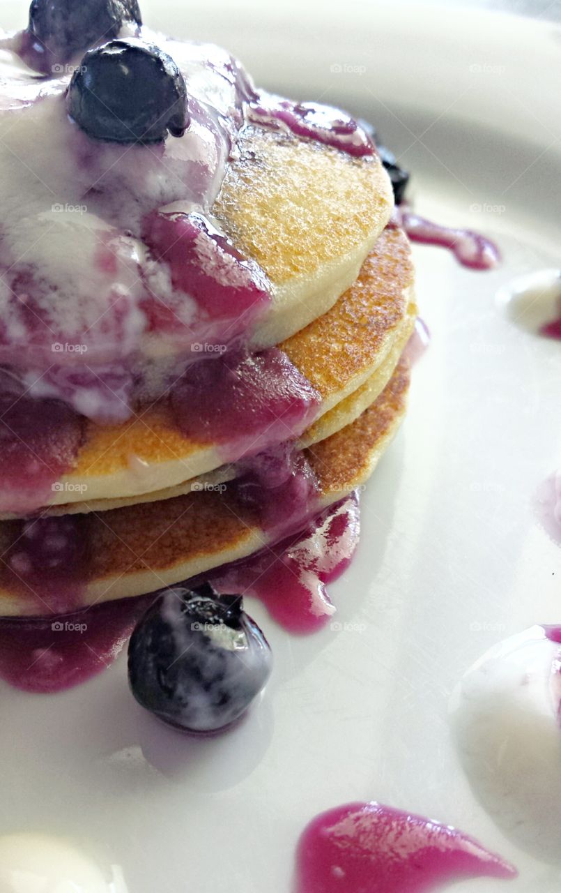 Blueberry pancakes food photography white background