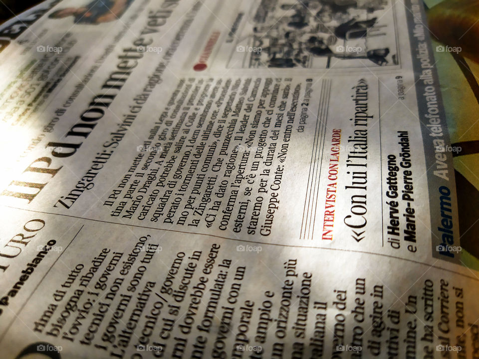 Part of an Italian newspaper hit by a ray of sun