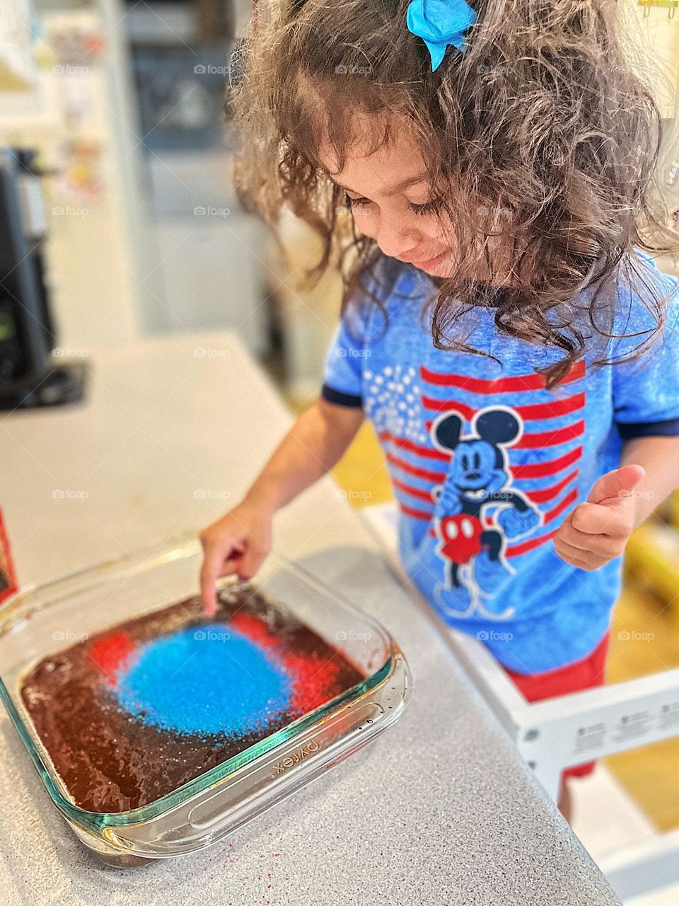 Toddler makes Red White And Blue Brownies, toddler makes dessert for party, Fourth of July party, fun with toddlers, Independence Day party, lots of sugar dumped out by toddler