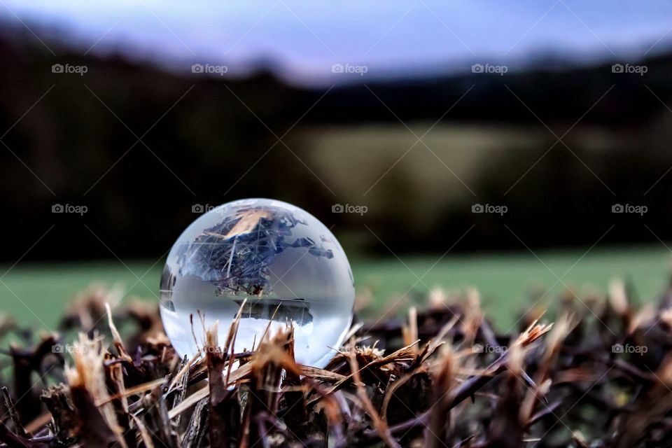 Close-up of paper weight on wood