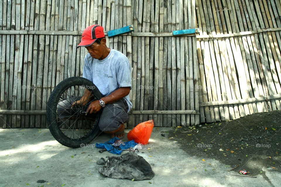 mechanic fixing a tire. motorcycle mechanic fixing a tire