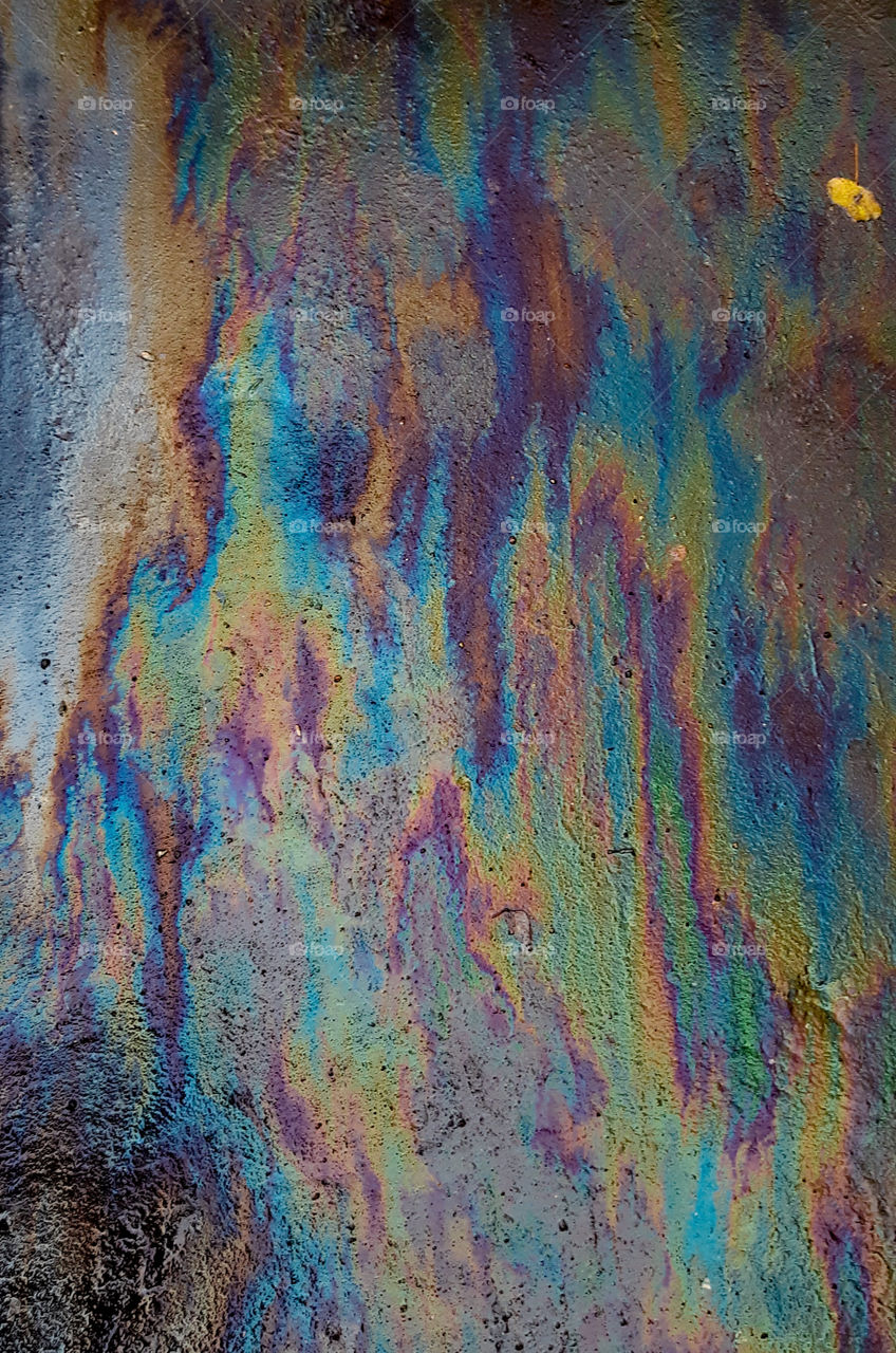 gasoline stains on asphalt. made with phone.