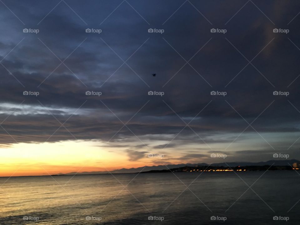 Scenic view of cloudy sky over calm sea